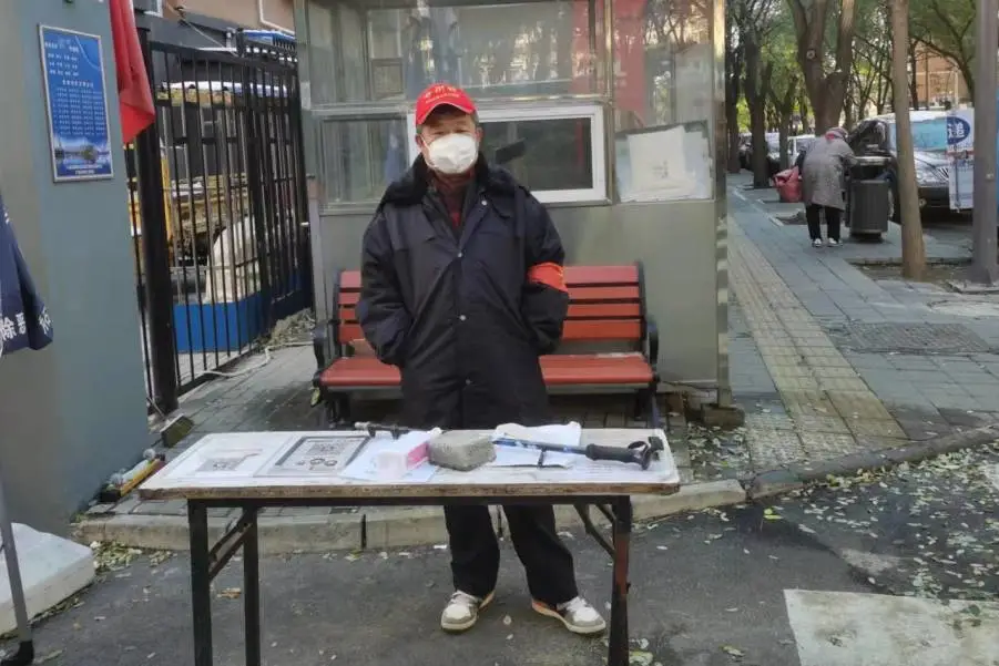 从不“缺勤”夫妻档志愿者感动居民